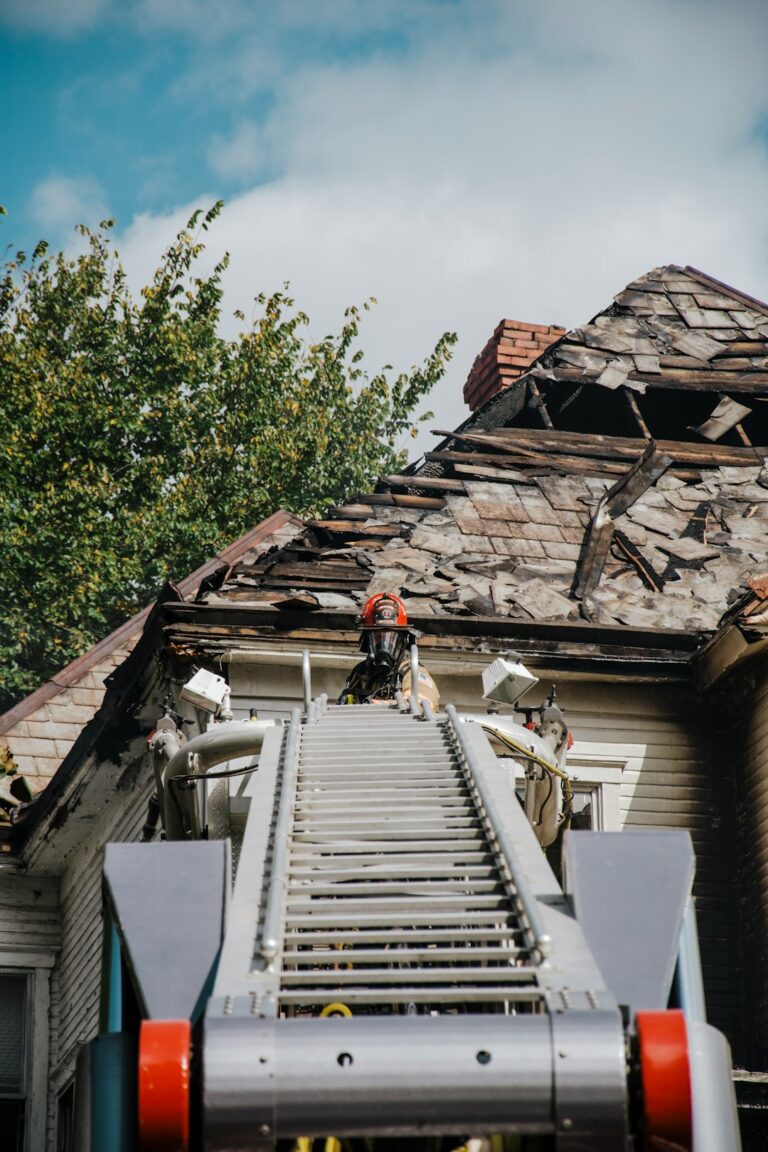 Homeowner inspecting roof shingles and gutters from the ground beside a ladder and maintenance checklist.